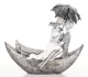 Csónakázó pár az esőben szobor, Ezüst